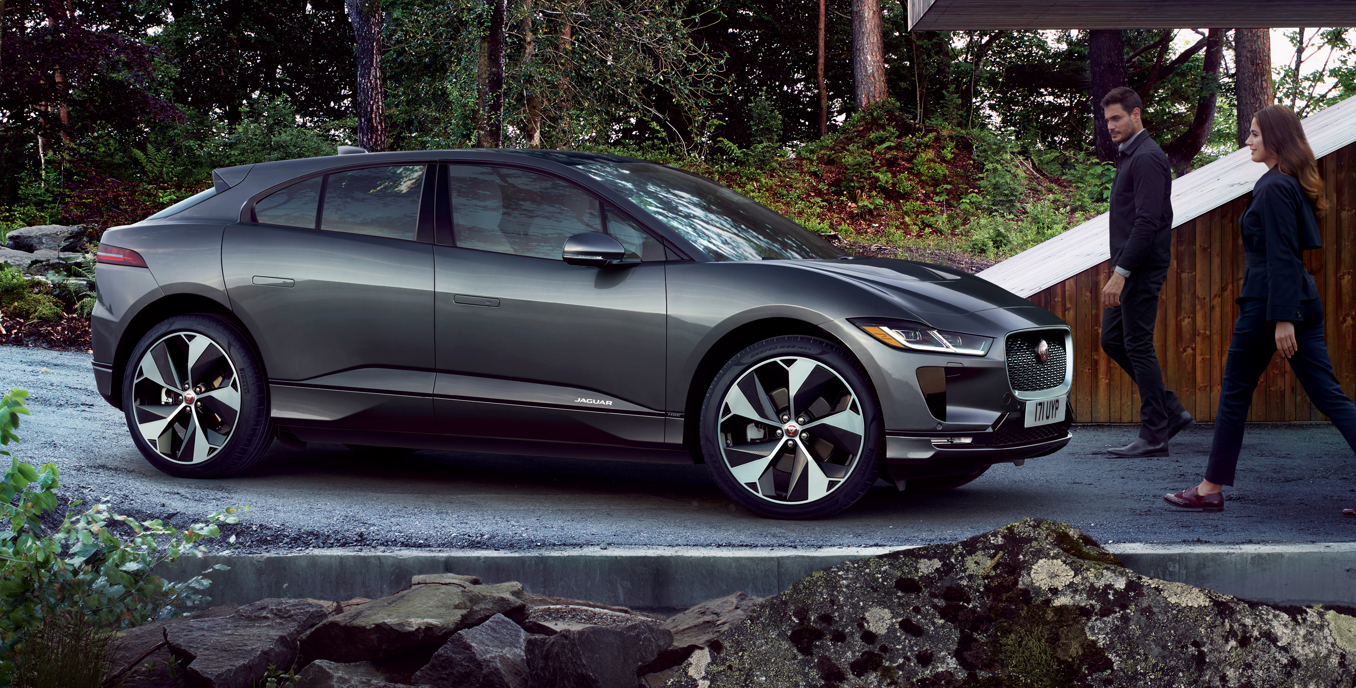 Couple walking towards a Jaguar I-PACE